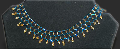Blue and gold egyptian weave necklace.
